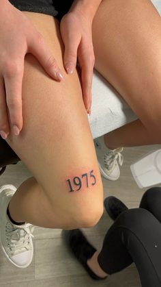 1975 tattoo above knee Year Knee Tattoo, 2005 Above Knee Tattoo, 2002 Above Knee Tattoo, Birth Year Tattoo On Leg, Year Above Knee Tattoo, Tattoo Ideas Knee Female, Number Knee Tattoo, Tattoo Ideas Female Knee, 2002 Knee Tattoo