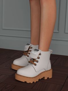 a woman's legs and white boots with brown laces