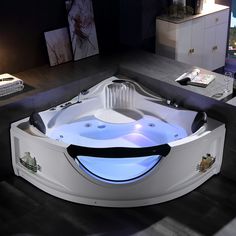 a large white bath tub sitting on top of a tiled floor