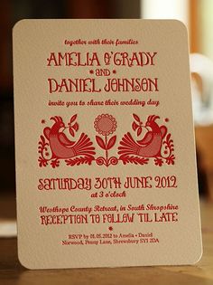 a wedding card with an image of two birds on the front and back, in red ink