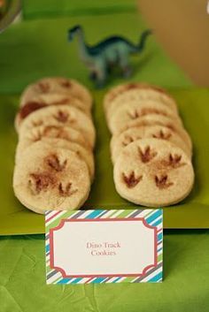 some cookies are on a green plate with a name tag