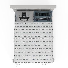 the batman bedding set is shown in grey and white with an image of batmobiles on it