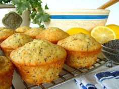 muffins cooling on a wire rack with lemon and black pepper in the background