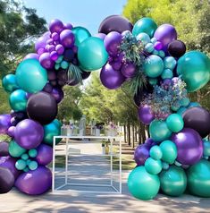 an arch made out of balloons and flowers