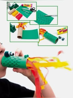 a young boy is playing with construction paper and crafting supplies in front of him