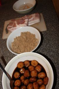 two bowls filled with food sitting on top of a counter next to a cutting board