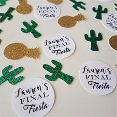 some green and gold confetti stickers on a table