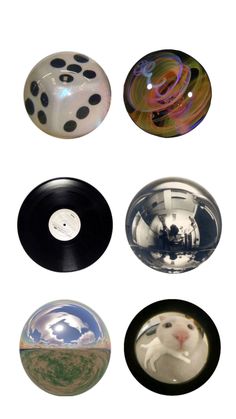 four different types of glass balls with black and white dots on them, all in the same pattern