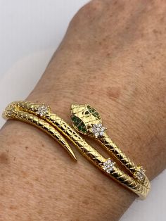 Vintage Snake Bangle Bracelet Gold filled Green Crystal Eyes
https://www.etsy.com/listing/1336074908/vintage-snake-bangle-bracelet-gold Elegant Snake-shaped Bangle As Gift, Elegant Snake-shaped Bangle For Gift, Flexible Gold-plated Bangle As Gift, Elegant Snake Shape Bangle Gift, Elegant Snake Shape Bangle Perfect For Gift, Flexible Gold Bangle Bracelet As Gift, Flexible Gold Bangle Bracelet For Gift, Flexible Gold Snake Bracelet, Gold Snake Shape Bracelet As Gift