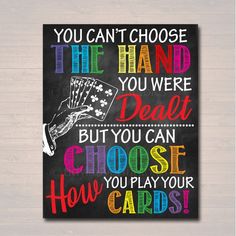 a chalkboard sign that says you can't choose the hand you were dead but you can choose how to play your cards