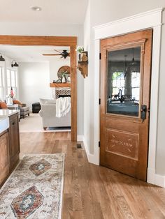 a living room filled with furniture and a wooden door