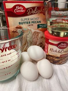 eggs, butter, and other ingredients are on a table