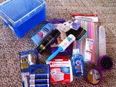 an assortment of personal care items laid out on the floor next to a blue container