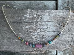 ✦Delicate and eye catching, gorgeous Czech glass matte frosted beads in opaque various pinks, blues and greens colours, single strand short necklace. The 19 main beads are capped, with tiny silver seed beads at back of necklace, silver plated brass space finished clasp and extension chain. This necklace is a delight. ✦Center barrel tube bead 6x13mm.  Seed beads vary from 6mm to 4mm, at back 2mm beads. ✦Length of necklace 42.cm (16 1/2") approximately, plus a 6cm (2 1/2") extension chain. ✦ I hav Adjustable Czech Glass Necklaces For Festivals, Adjustable Czech Glass Necklace For Festivals, Bohemian Silver Czech Glass Necklaces, Bohemian Pink Czech Glass Beaded Necklaces, Bohemian Silver Necklace With Czech Glass, Bohemian Czech Glass Beaded Necklace With Tiny Beads, Greens Colours, Indie Gifts, 2mm Beads