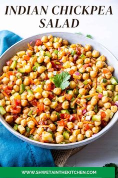 a white bowl filled with corn and garnish on top of a blue napkin