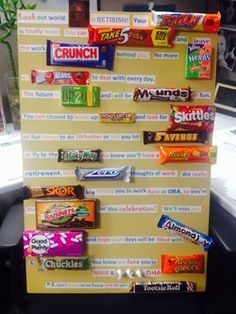 an office cubicle with candy bars on it