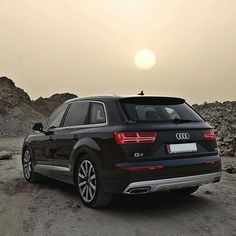 an audi suv is parked in the desert