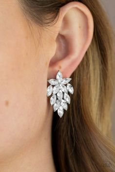 Featuring dainty silver studded accents, a sparkly collection of marquise cut white rhinestones flare out from the bottom of floral arranged rhinestones for a flauntable finish. Earring attaches to a standard post fitting. Sold as one pair of post earrings. Paparazzi Accessories, White Rhinestone, White Earrings, Paparazzi Jewelry, Floral Earrings, See Me, Marquise Cut, Rhinestone Earrings, Silver Studs