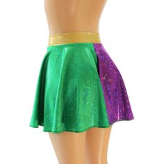 "Green and Purple Holographic Spandex Circle Skirt with a 2\" Hologram Wasitband. You are sure to be sparking at your next event in this sassy little skirt! WAISTBAND OPTIONS 1. GREEN HOLOGRAM 2. PURPLE HOLOGRAM 3. GOLD HOLOGRAM SKIRT LENGTHS Skirt Lengths: Front/Back Toddler 2/37\"/8\" Child X-Small 10\" / 11\" Child Small12\"/13\" Child 6X-711\"/12\" Child Medium13\"/14\" Child Large13\"/14\" Adult XS 13\"/14\" Adult Small 14.5\" / 16\" Adult Medium14.5\"/16\" Adult Large15\"/17\" Adult X-Larg Fitted Party Skort With Elastic Waistband, Fitted Mini Skirt With Elastic Waistband For Night Out, Fitted Party Skirt With Elastic Waistband, Fitted Skirt With Elastic Waistband For Party, Multicolor Party Bottoms With Elastic Waistband, Purple Stretch Bottoms For Cheerleading, Stretch Skirt For Cheerleading, Disco Fitted Mini Skirt, Fitted Green Skirt With Elastic Waistband