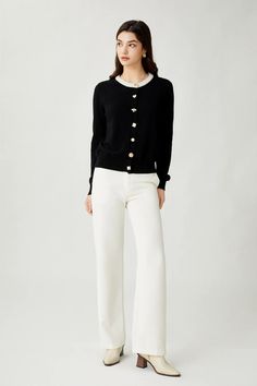 A black wool sweater with a round neck and white-colored design at the neckline. It has gold-colored metal buttons on the front and ribbing at the bottom and cuffs. This sweater is perfect for everyday wear. Its black color and simple design make it easy to pair with a variety of outfits. The white neckline and gold buttons add a touch of elegance to the sweater. As for styling, this sweater would look great paired with a pair of black jeans and boots for a casual, everyday look. Black Wool Sweater, Jeans Outfit Fall, Button Fashion, White Jeans Outfit, Work Fits, Knitwear Dress, Of Outfits, Kpop Fashion Outfits, Kpop Fashion