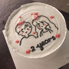 a birthday cake with two cats on it