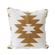 a brown and white pillow with an arrow pattern on the front, sitting on a white background