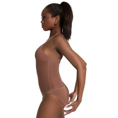 Elevate your performance in this plunging front neck leotard. Features padded cups and opaque mesh at the midriff that offers coverage and light compression. Comes with both clear and dyed-to-match bra straps that adjust and transition for different looks and functional support. Offered in a higher leg line to remain concealed under costumes. Stretch Nylon Leotard With Lined Body, Fitted Nylon Leotard, Seamless Second-skin Nylon Leotard, Second-skin Leotard With Built-in Bra For Dancewear, Nylon Shapewear Bodysuit For Workout, Nylon Workout Shapewear Bodysuit, High Stretch Nylon Leotard For Shapewear, High Stretch Dancewear Bodysuit With Built-in Bra, High Stretch Nylon Bodysuit For Dancewear