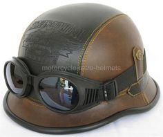 a brown leather motorcycle helmet with goggles on the top and side view mirror in the middle