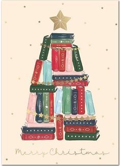 a christmas tree made out of books with a star on top