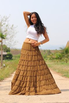 All items are shipped to Thailand Post . Free upgrade to D.H.L Express when you buy 2 or more items . The USA only. Please leave a phone number with orders. Full-length skirt in a beautiful soft cotton Boho style skirt with 10 tiers and 10 layers of ruffles all around and half lined. Drawstring waist with a small 7'' inch long zip. A great skirt to wear with a tight or cropped top. Easy to care for wash cold cycle, hang to dry or tumble dry low. Waist 33'' inches max ( drawstring ) Length 44'' i Full Length Fitted Bohemian Skirt, Hippie Style Fitted Ruffled Maxi Skirt, Fitted Hippie Ruffled Maxi Skirt, Hippie Fitted Ruffled Maxi Skirt, Brown Lined Tiered Skirt, Brown Tiered Lined Skirt, Bohemian Brown Flared Skirt, Hippie Fitted Maxi Skirt With Ruffles, Brown Ruffled Long Skirt