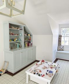 a child's play room with toys on the table