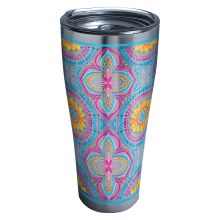 the colorful flower design is on this tumbler cup