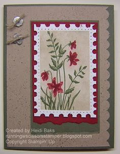 a handmade card with red flowers and green leaves on the bottom, in front of a white background