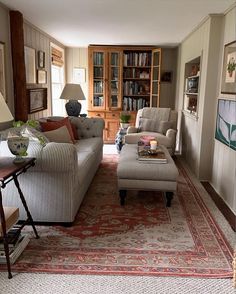 a living room filled with furniture and a rug