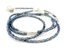 Shiny and bohemian eyeglass necklace chain in blue, silver and light purple tones, made with Preciosa Czech crystal seed beads and silver plated crystal seed beads Paired with shiny silver plated bar charms, this handmade eyeglass chain will definitely create a unique look. This eyeglass lanyard is made on strong quality beading wire with silver plated wire guardians that protect the quality eyeglass holder grips. The necklace is ended with spring clasps that hold the eyeglass grips and they can Silver Bohemian Glasses Chains Gift, Silver Glass Jewelry For Festival, Silver Glass Glasses Chains For Festival, Silver Glasses Chains With Lobster Clasp And Round Beads, Blue Glass Jewelry For Festivals, Handmade Silver Glasses Chains For Festival, Grandma Glasses, Eyeglass Necklace, Grandma Necklace