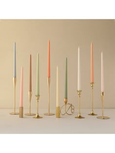 six candles are lined up in different colors