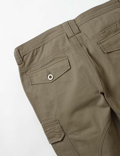 Twill pant with dual cargo pockets with flaps, direct Pigeon embroidery on left cargo pocket, front slant pockets, back welt pockets with flaps, reinforced seat, zip fly, and adjustable drawstring ankle closures. 100% Cotton. Imported. By Staple Pigeon.Style: 2209B7073 Military Style Work Pants For Outdoor Activities, Khaki Cargo Pants For Outdoor Activities, Khaki Cotton Cargo Pants With Flap Pockets, Khaki Tapered Leg Cargo Jeans With Hip Pockets, Khaki Cargo Jeans With Hip Pockets And Tapered Leg, Khaki Work Pants With Cargo Pockets, Khaki Cargo Work Pants, Outdoor Tapered Leg Cargo Jeans With Pockets, Khaki Work Pants With Multiple Pockets For Outdoor Activities