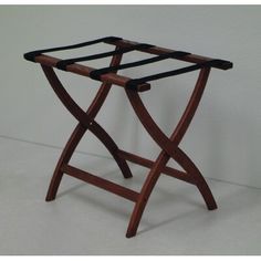 a small wooden table with black straps on it