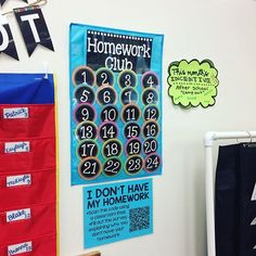 a bulletin board is hanging on the wall next to some posters and magnets that read homework club, i don't have my homework