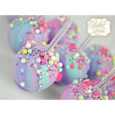 cake pops covered in sprinkles and colored frosting