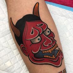 a man with a red mask on his leg