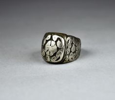 "Antique Berber solid silver ring finely decorated with engraved waving-shaped motifs on the front and on both sides. The front side of the ring measures 0.74 X 0.62 inches (19 X 16 mm), and the inner diameter of the ring measures 0.78 inches (20 mm). Beautiful antique patina of the silver. Provenience: Essaouira, Morocco. Weight: 24.7 g. Ring size (US): 10 1/4 Back to \"Rings\" section: https://www.etsy.com/shop/ArteOrientaleBologna?ref=hdr_shop_menu%C2%A7ion_id%C2%A7ion_id&section_id=18844837 Essaouira Morocco, G Ring, Band Rings, Silver Ring, Patina, Jewelry Rings, Ring Size, Silver Rings, Band