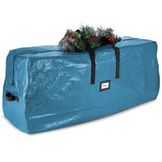 a large blue bag with christmas decorations on top