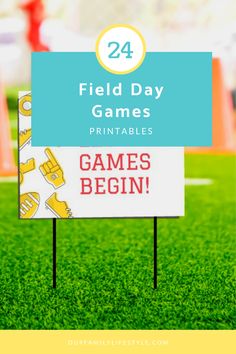 a field with a sign that says field day games printables are on it