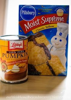 a can of cake next to a box of frosted pumpkin pies on a counter