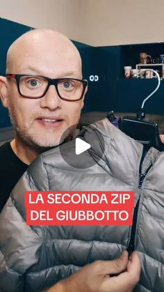 a man holding up a jacket with the words la seconda zip del giubboto