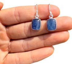 This listing is for a single (1) pair of beautiful Blue Kyanite Earrings in Sterling Silver Rectangle Bezel Dangle Setting.  This is an individual listing, so you will be purchasing the exact pair of Earrings in the photos above and described below. Please let us know if you have any questions about the item after reviewing the photos and details below! Crystals & Stones: Blue Kyanite Crystal Origin: Brazil Type: Dangle Setting: Bezel Shape: Rectangle Surface: Polished Cut: Cabochon Finish: Ster Blue Rectangular Gemstone Earrings, Kyanite Meaning, Taurus Element, Blue Kyanite Crystal, Kyanite Earrings, Kyanite Crystal, Crystals Stones, Rectangle Earrings, Les Chakras