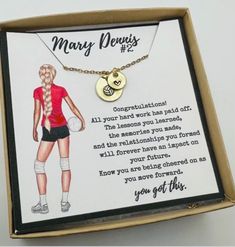 a box with a necklace in the shape of a woman's torso and name on it