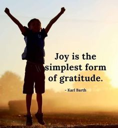 a person jumping up in the air with their arms raised and saying joy is the simplest form of gratitude