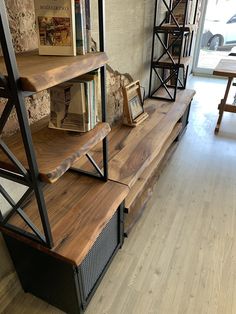 the shelves are made out of wood and metal